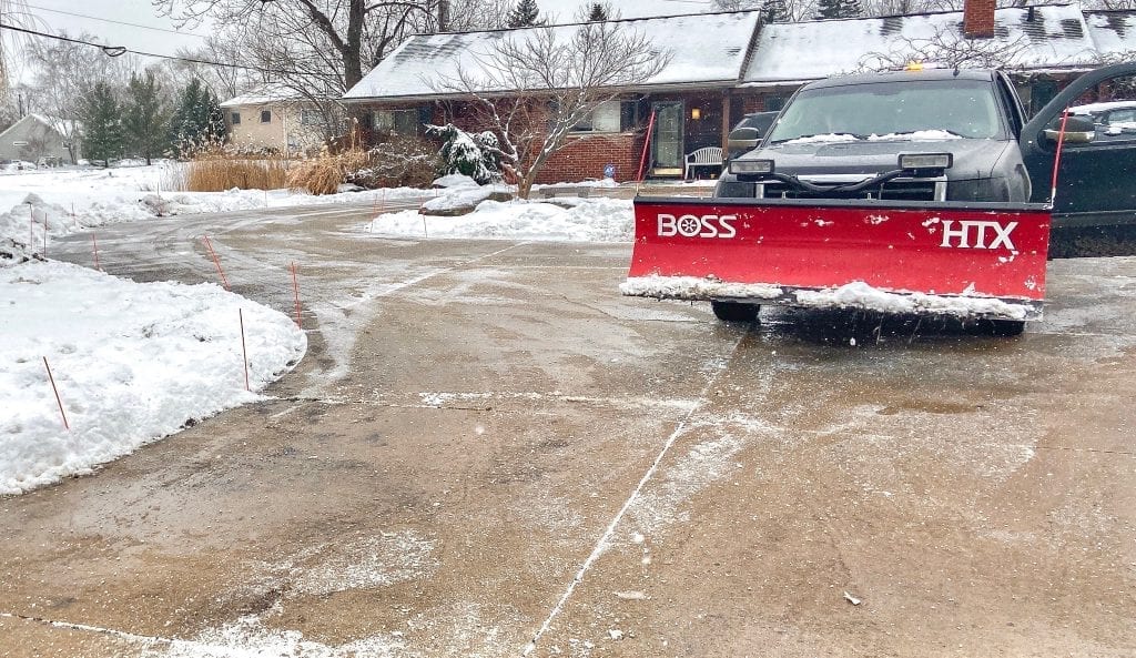 Snow plowing a driveway in Northville, Michigan with a Boss Snow Plow