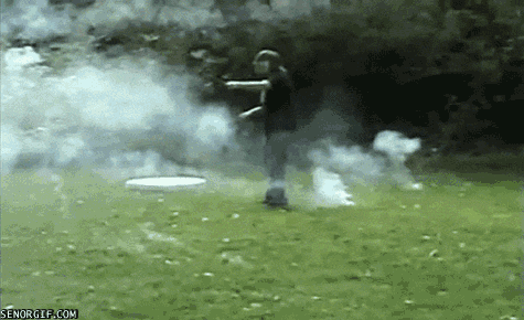 Smoke bomb firework hitting a person in the face