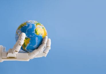 robot holding earth globe in hand