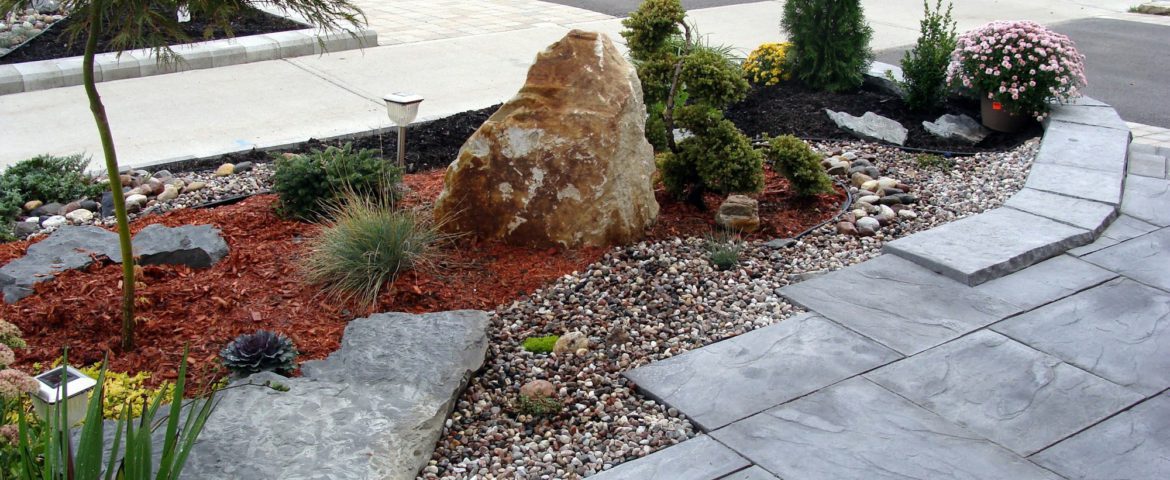 Landscaping project in front of the house, rock garden, travertine tiles, planting evergreens design