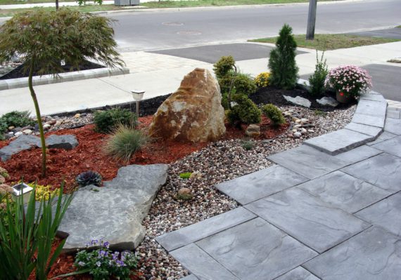 Landscaping project in front of the house, rock garden, travertine tiles, planting evergreens design