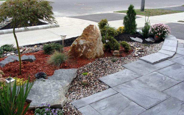 Landscaping project in front of the house, rock garden, travertine tiles, planting evergreens design