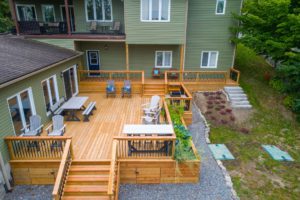 A deck with chairs and tables